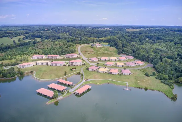 Aerial view of the Bridgewater Bay development, showing tile-roofed homes set along the lake shoreline